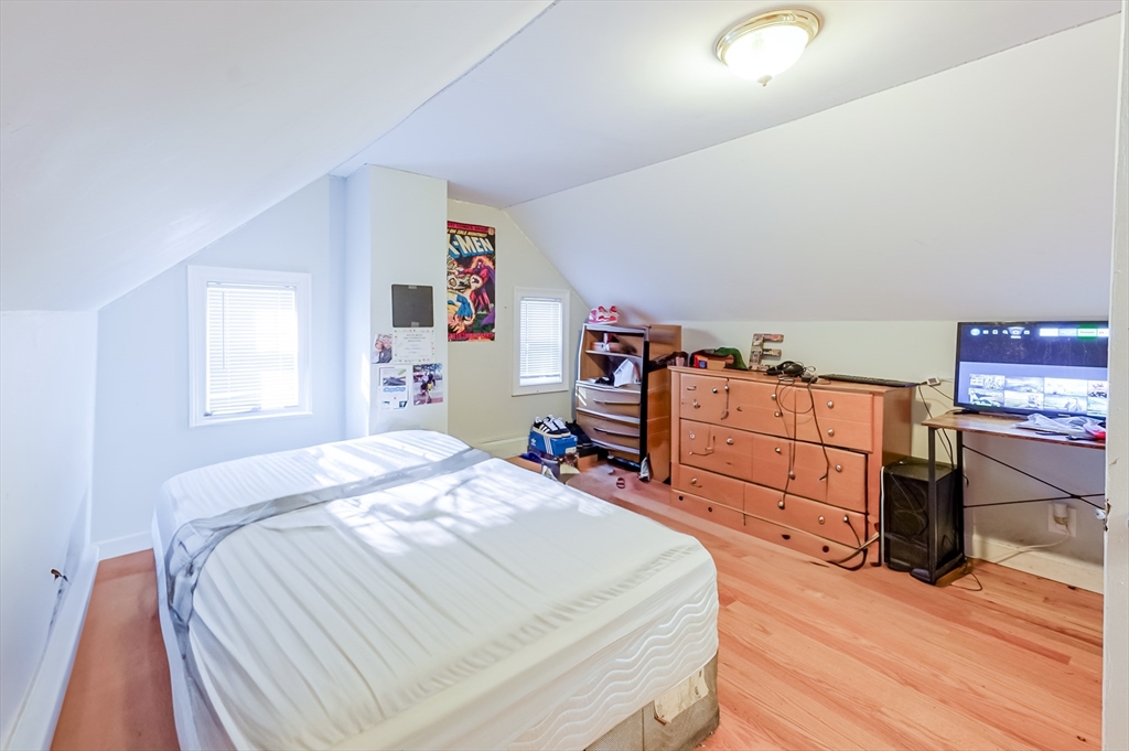 5 Oliver Street Randolph, MA 02368 - Photo 28 of 29 a bedroom with a bed and furniture