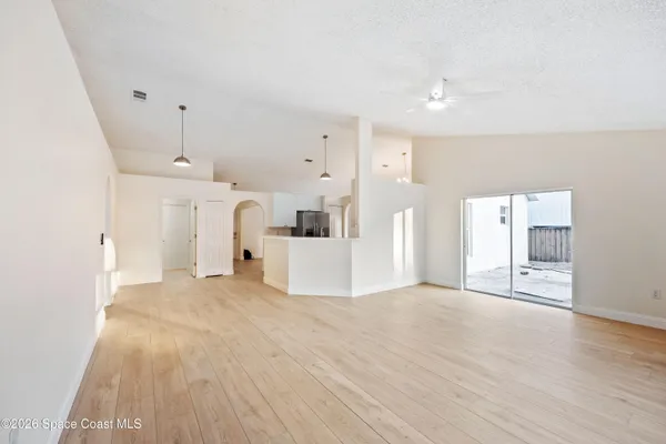 a view of a livingroom with a kitchen