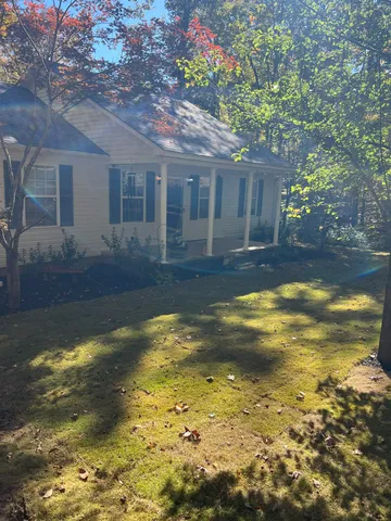 a view of a house with swimming pool