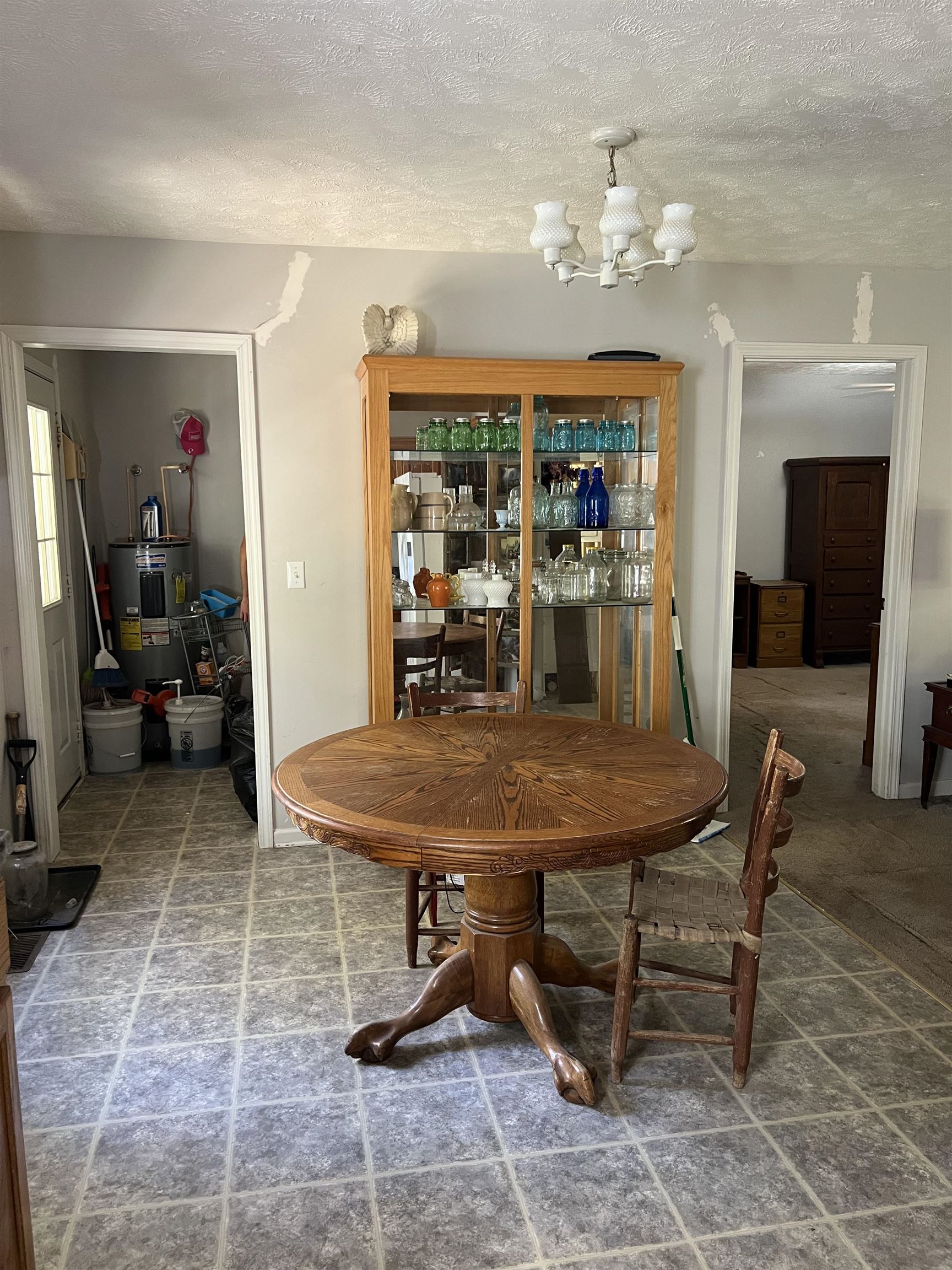 191 Crabtree Road Selmer, TN 38375 - Photo 6 of 12 a dining room with furniture and a chandelier