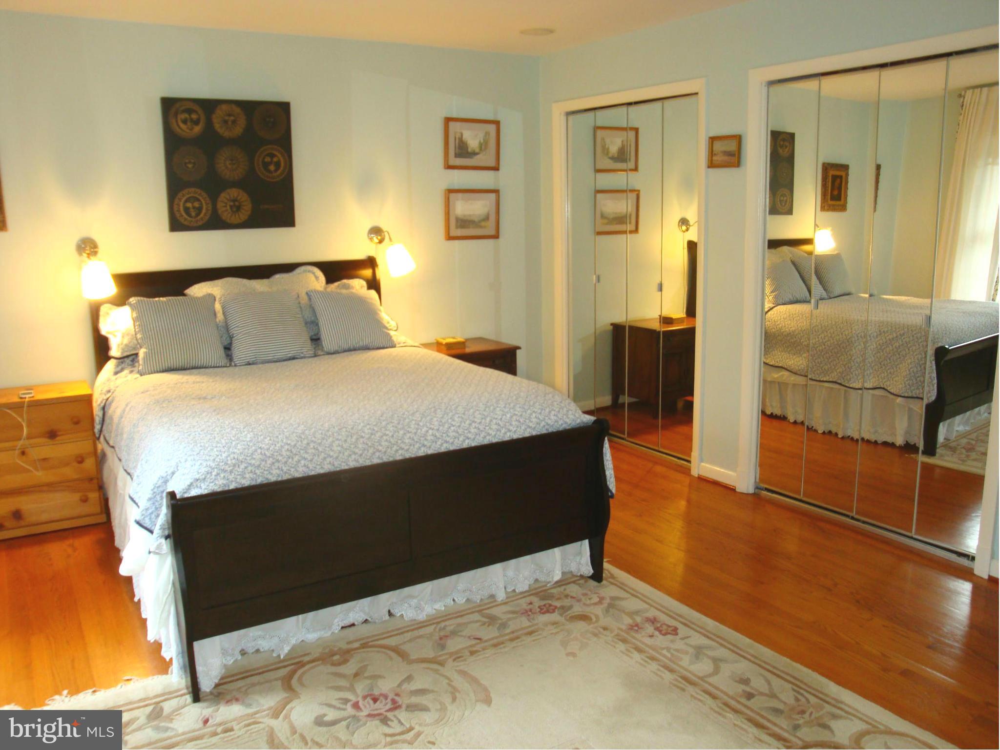 901 Huntsman Road Towson, MD 21286 - Photo 12 of 30 a bedroom with a bed and wooden floor