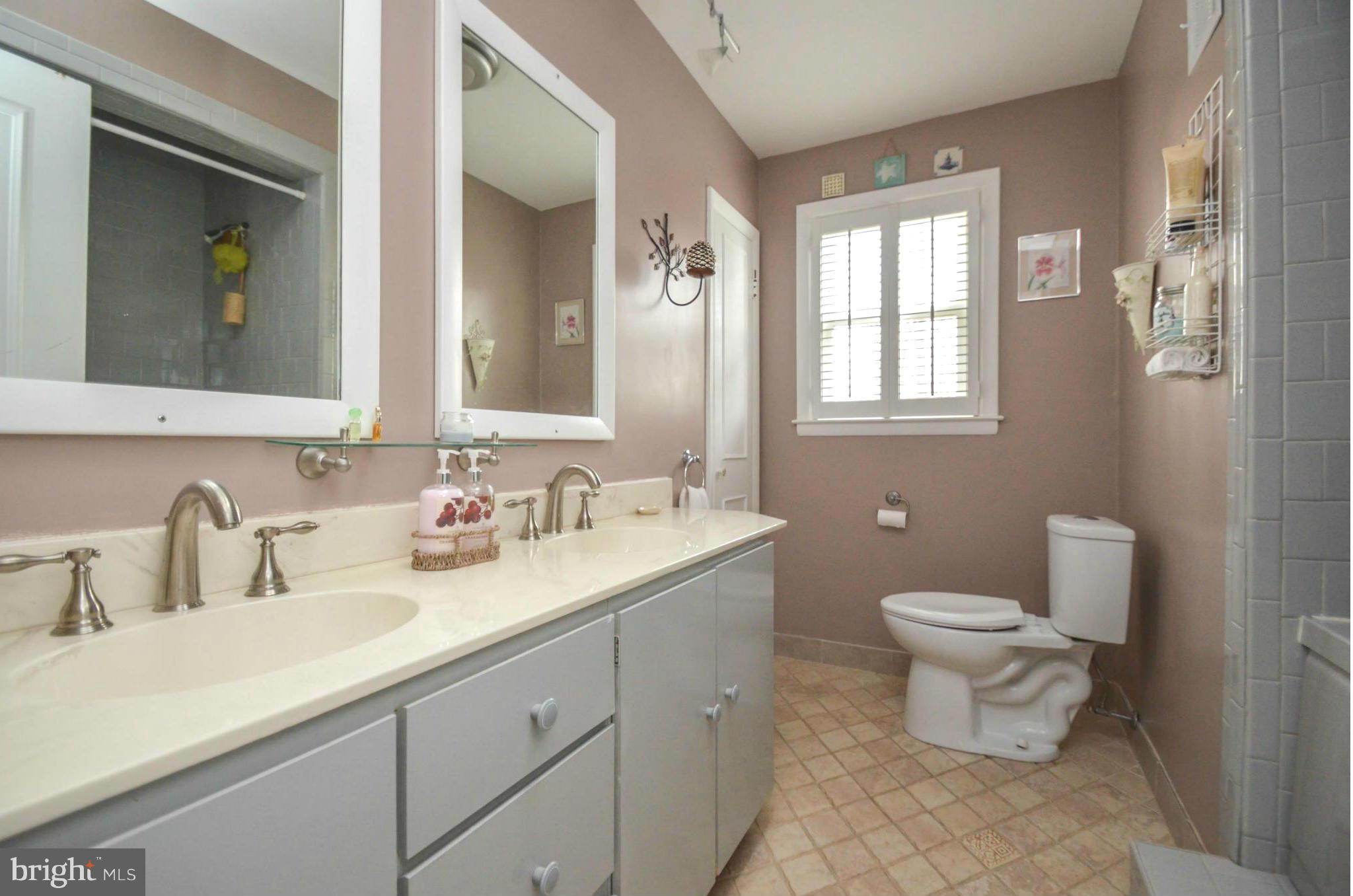 901 Huntsman Road Towson, MD 21286 - Photo 16 of 30 a bathroom with a toilet sink and mirror