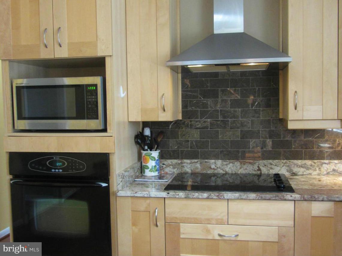 901 Huntsman Road Towson, MD 21286 - Photo 5 of 30 a kitchen with a stove and a microwave