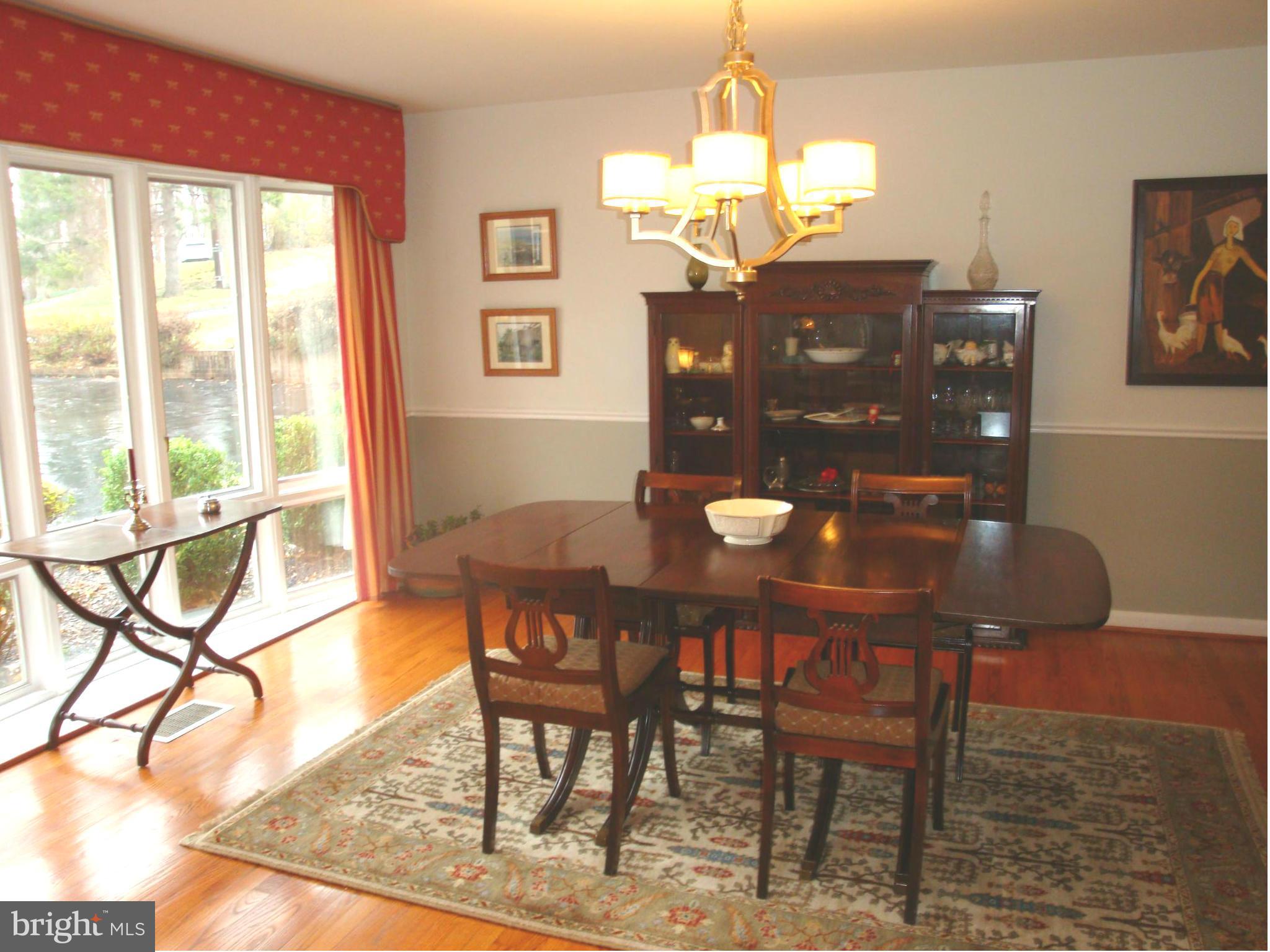901 Huntsman Road Towson, MD 21286 - Photo 7 of 30 a view of a dining room with furniture and wooden floor
