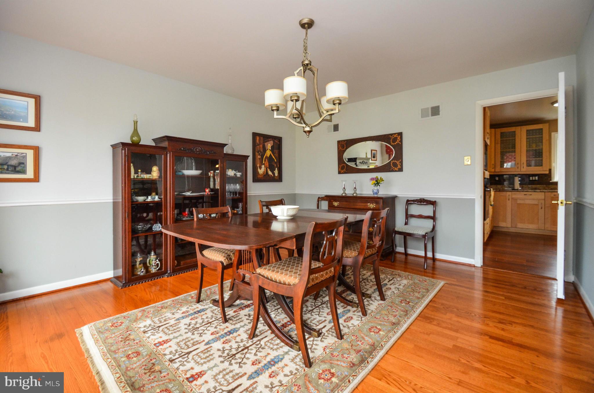 901 Huntsman Road Towson, MD 21286 - Photo 8 of 30 a view of a dining room with furniture and wooden floor
