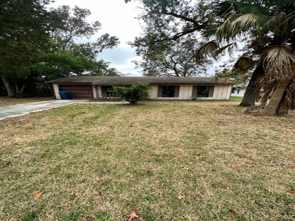 9288 Geneva Street Spring Hill, FL 34608 - Photo 1 of 1 Diamond in the Rough :)