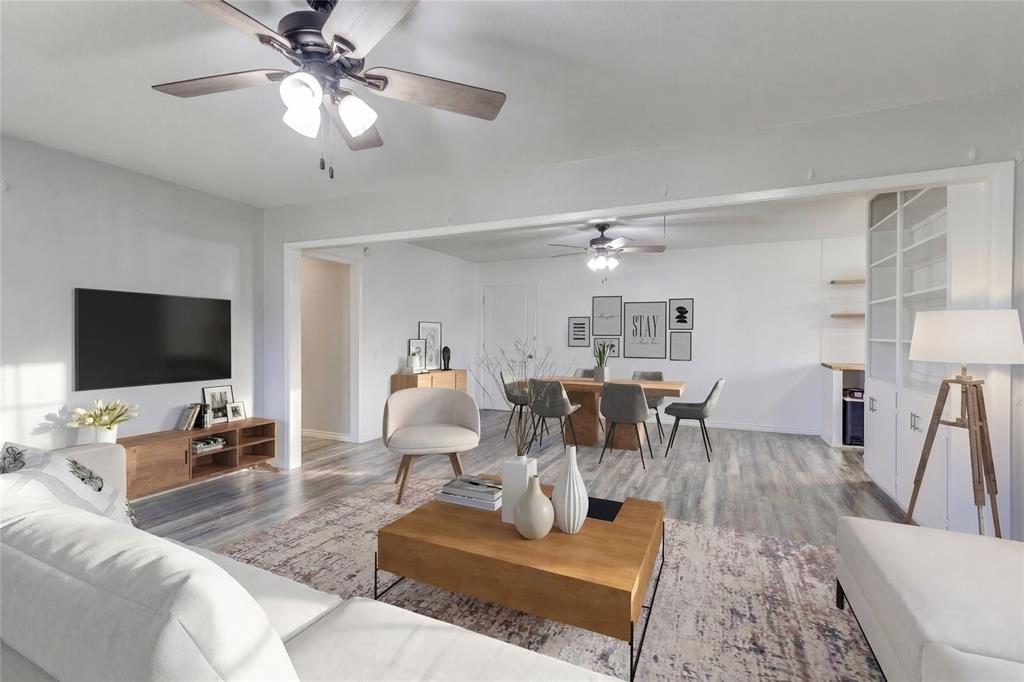a living room with lots of furniture and a flat screen tv