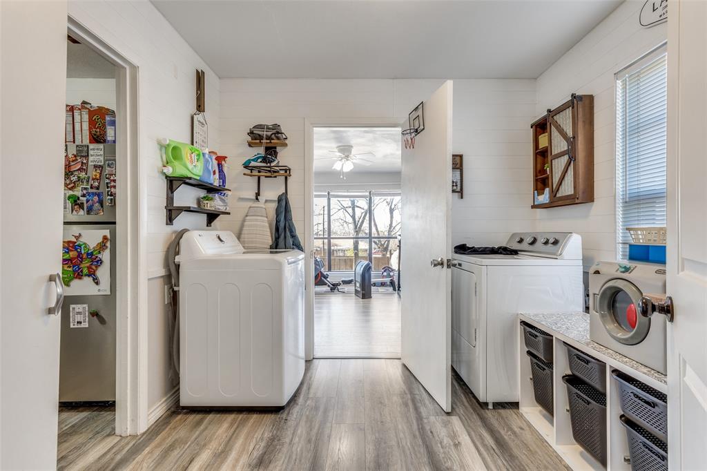 1304 South Hatcher Street Decatur, TX 76234 - Photo 11 of 36 a view of kitchen and utility room with wooden floor