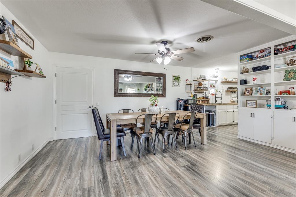 1304 South Hatcher Street Decatur, TX 76234 - Photo 12 of 36 a view of a dining room with furniture and wooden floor
