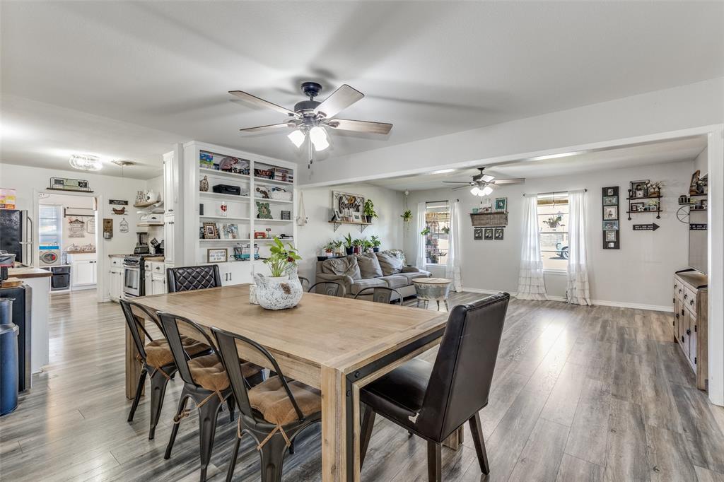 1304 South Hatcher Street Decatur, TX 76234 - Photo 14 of 36 a view of a dining room with furniture and wooden floor