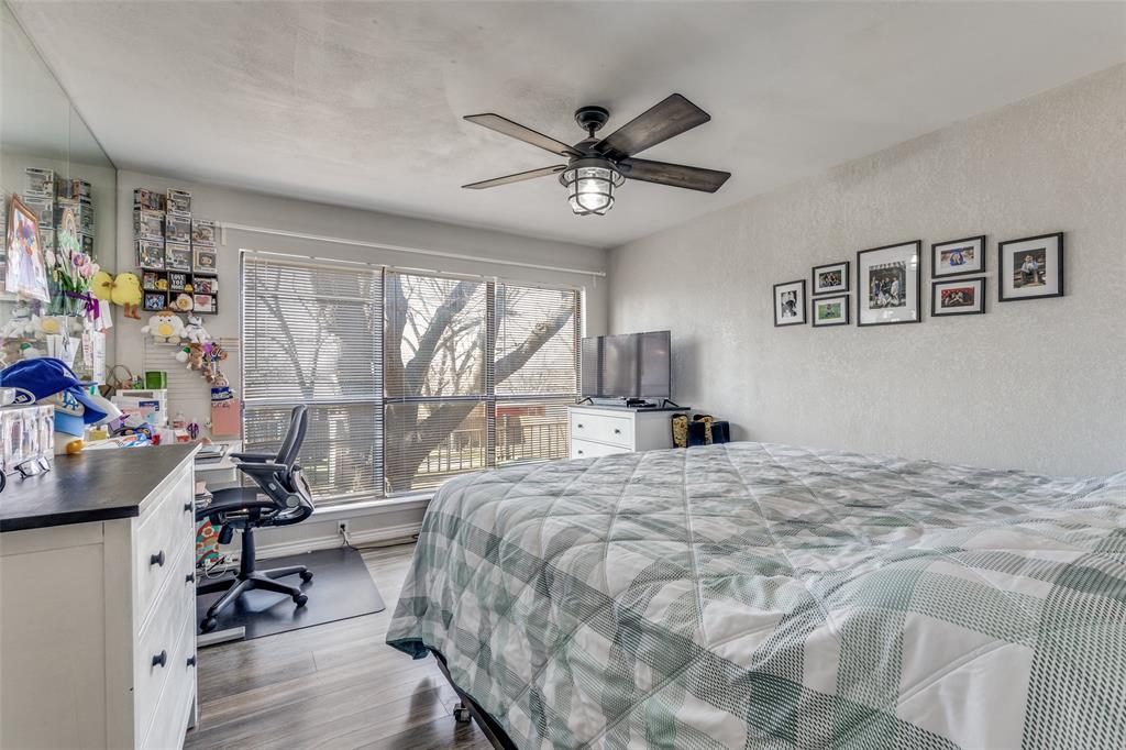 1304 South Hatcher Street Decatur, TX 76234 - Photo 17 of 36 a bedroom with a bed furniture and a large window
