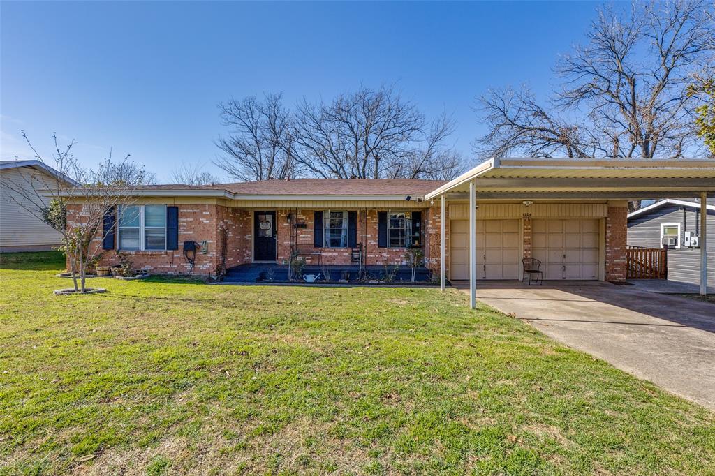 1304 South Hatcher Street Decatur, TX 76234 - Photo 2 of 36 a view of a house with a yard