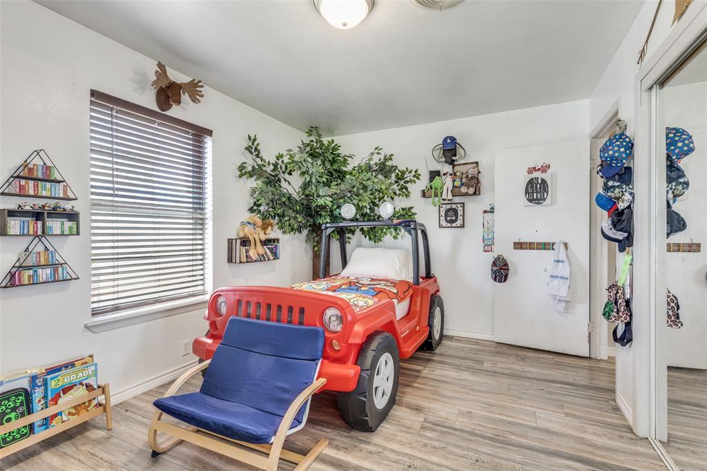 1304 South Hatcher Street Decatur, TX 76234 - Photo 24 of 36 a bedroom with a bed and a window
