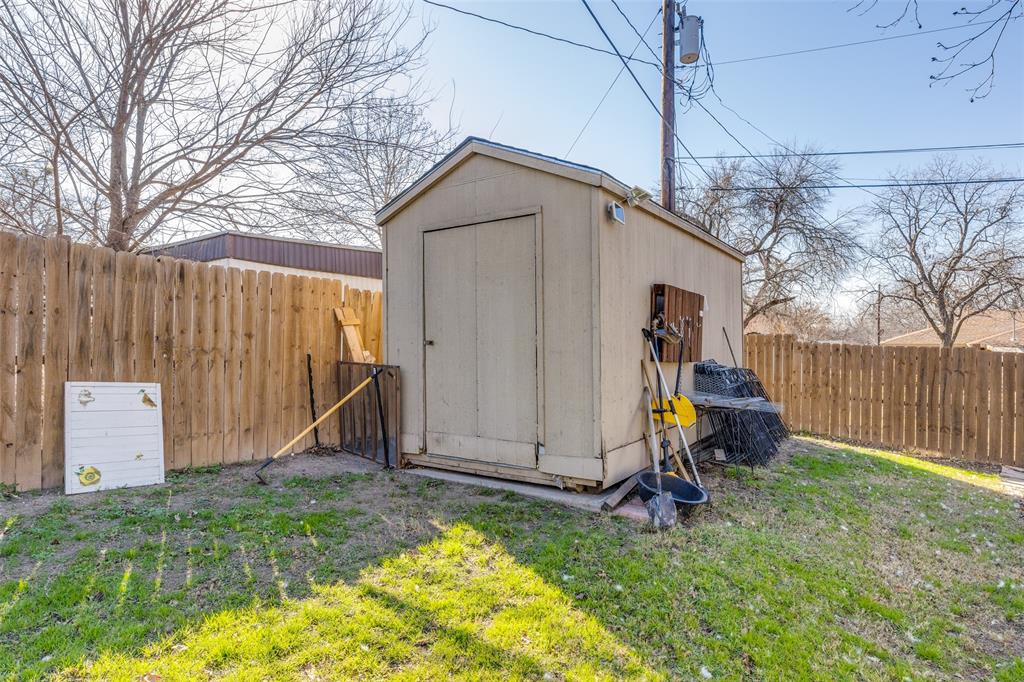1304 South Hatcher Street Decatur, TX 76234 - Photo 33 of 36 a view of backyard with wooden fence and a large tree