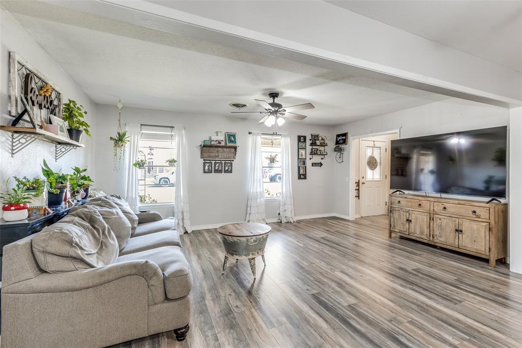 1304 South Hatcher Street Decatur, TX 76234 - Photo 5 of 36 a living room with furniture and a flat screen tv