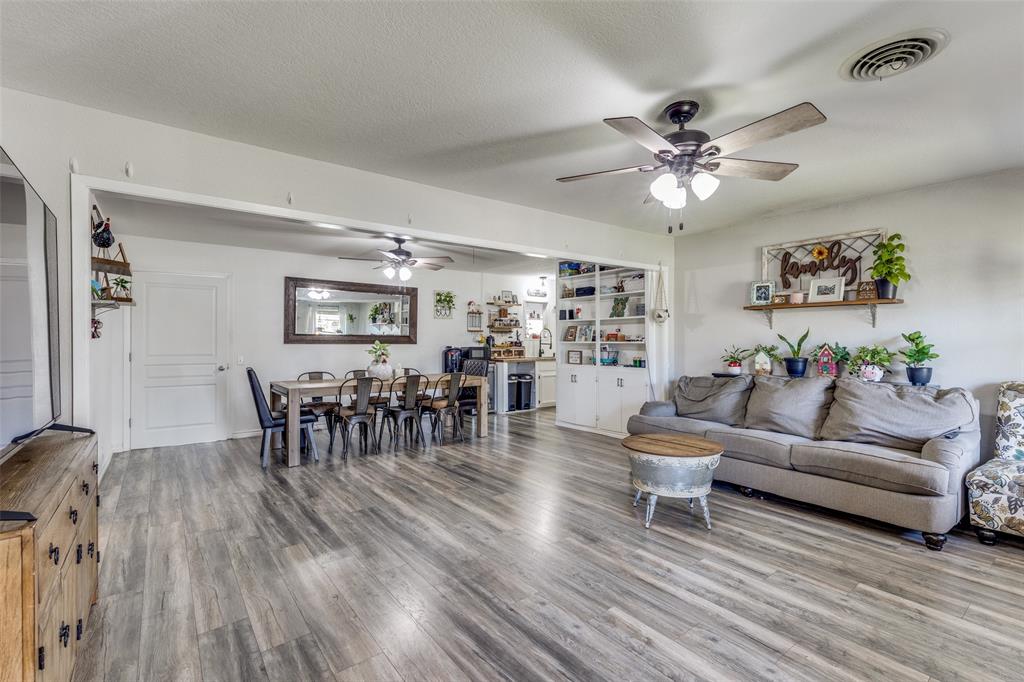 1304 South Hatcher Street Decatur, TX 76234 - Photo 6 of 36 a living room with furniture and wooden floor