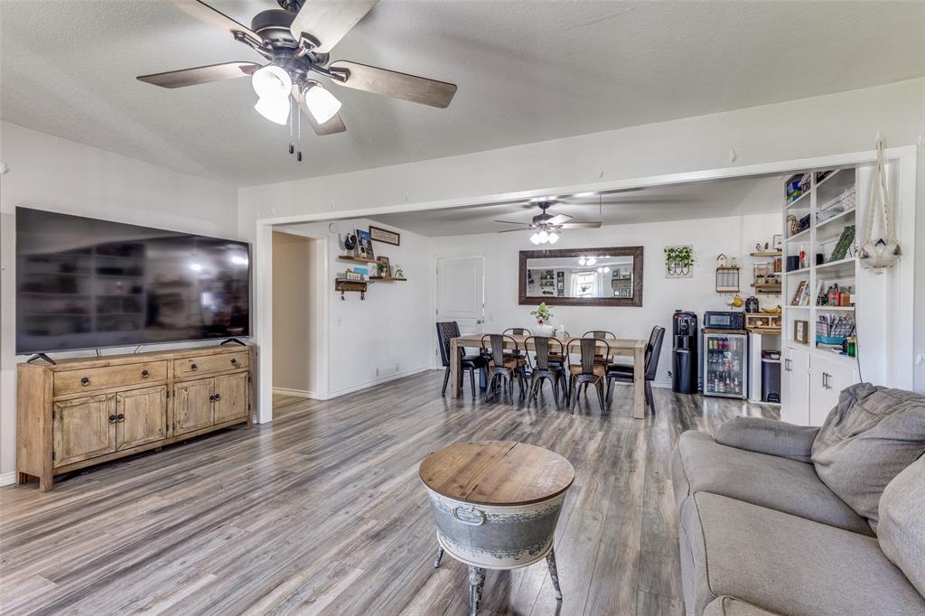 1304 South Hatcher Street Decatur, TX 76234 - Photo 7 of 36 a living room with furniture and a flat screen tv