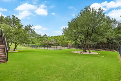 a view of an outdoor space and basketball court