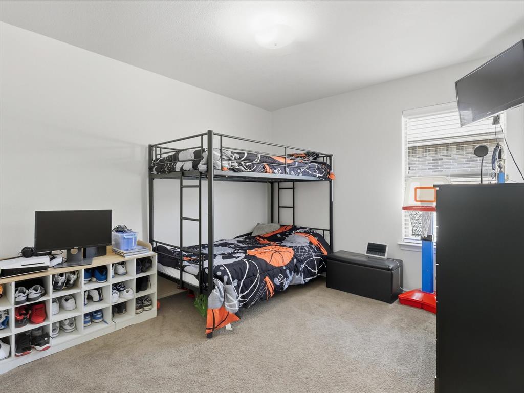 425 Merry Mill Road Wilmer, TX 75172 - Photo 13 of 29 a bedroom with bed and a window