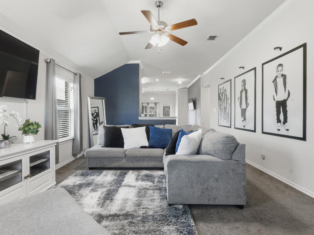 425 Merry Mill Road Wilmer, TX 75172 - Photo 4 of 29 a living room with furniture and a flat screen tv