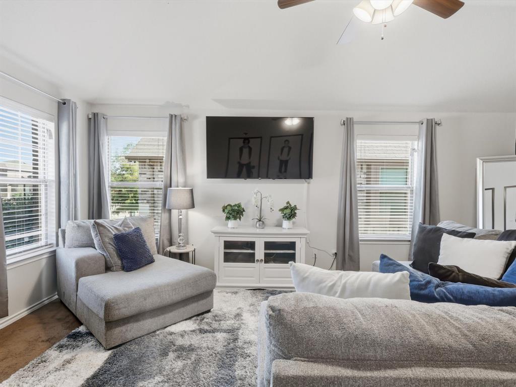 425 Merry Mill Road Wilmer, TX 75172 - Photo 6 of 29 a living room with furniture and a flat screen tv