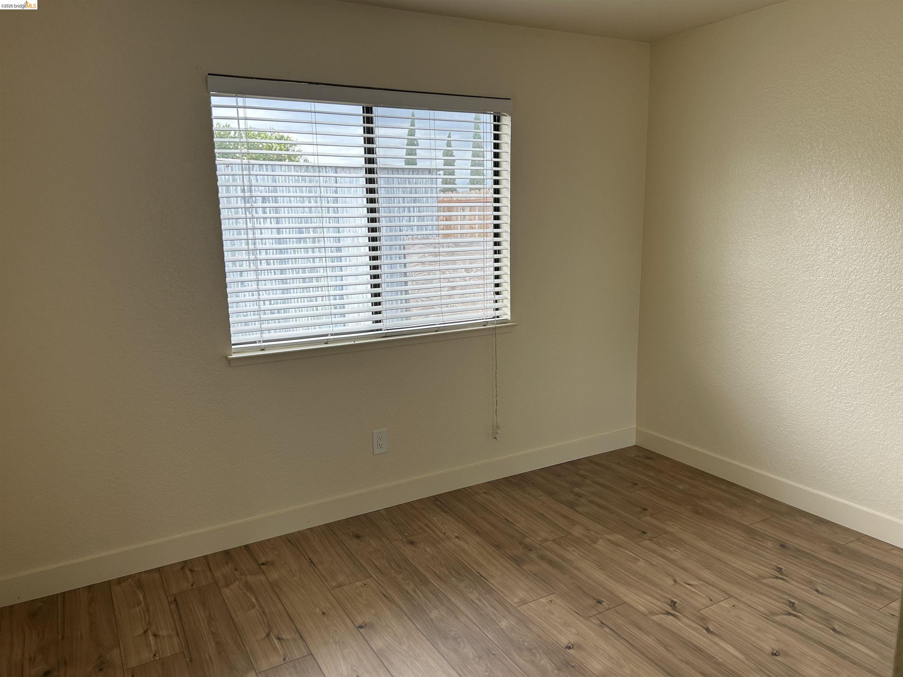 2632 Point Lobos Court Antioch, CA 94531 - Photo 17 of 27 Unfurnished room with wood finished floors and a textured wall
