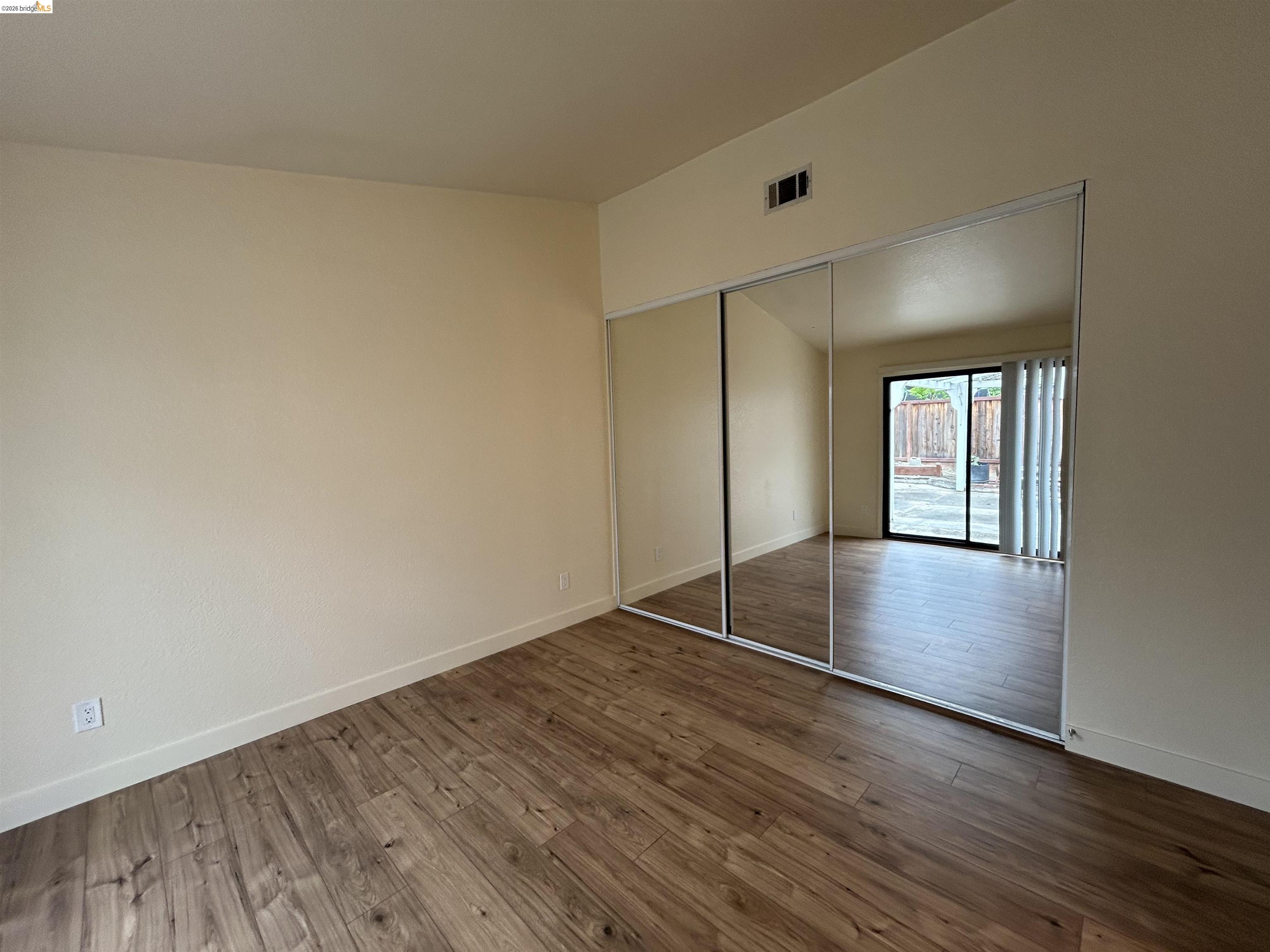 2632 Point Lobos Court Antioch, CA 94531 - Photo 19 of 27 Unfurnished bedroom featuring dark wood finished floors and a closet