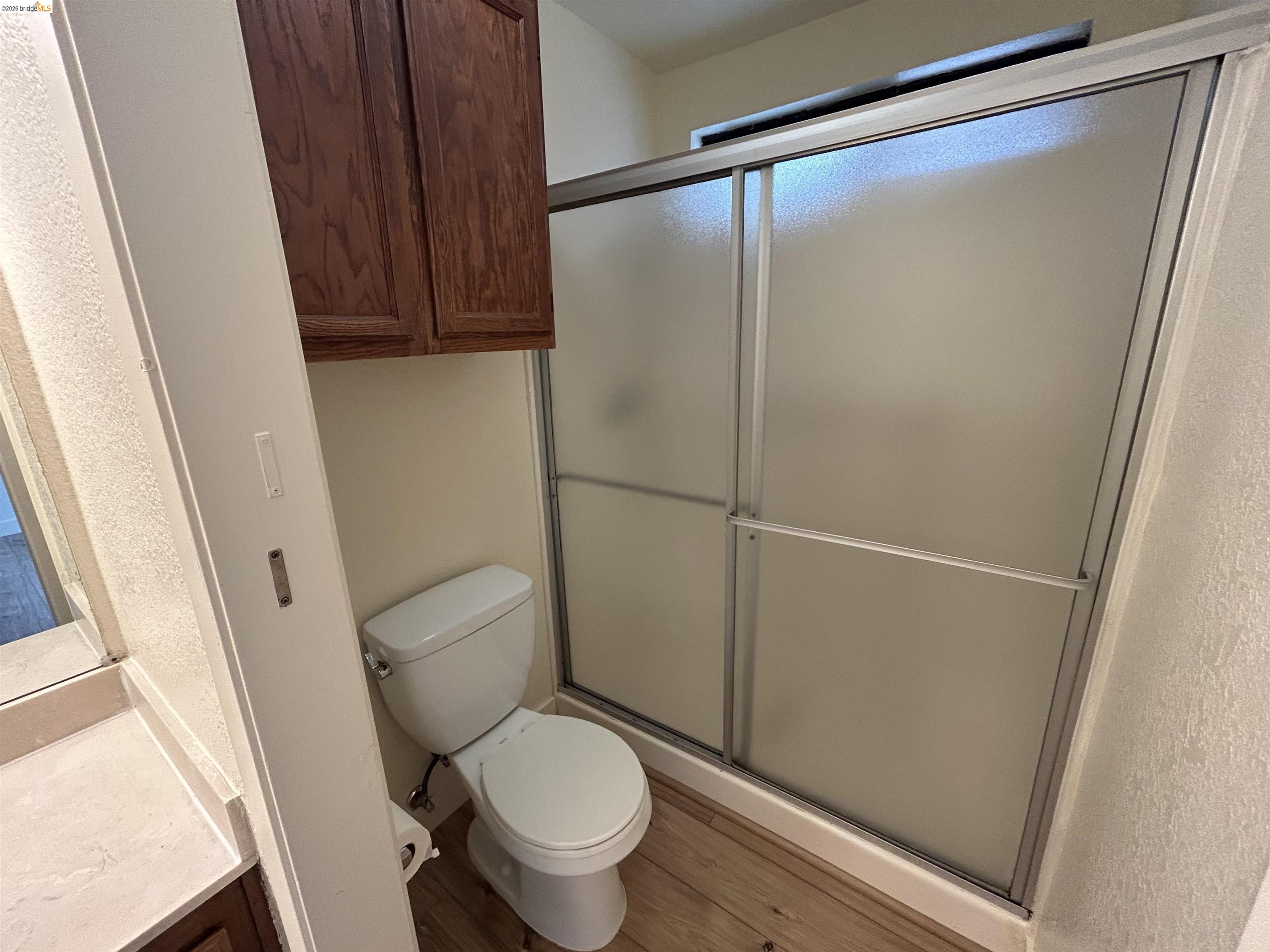 2632 Point Lobos Court Antioch, CA 94531 - Photo 22 of 27 Full bathroom featuring a stall shower, light wood-style flooring, and vanity