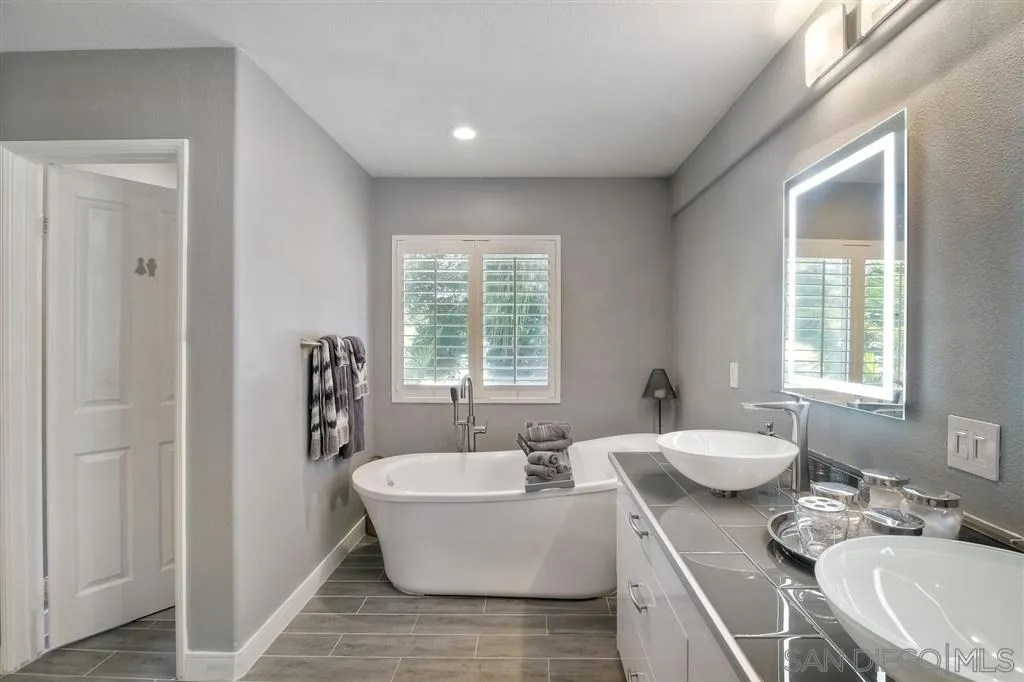 11564 Village Ridge Road San Diego, CA 92131 - Photo 17 of 25 a living room with furniture and a window