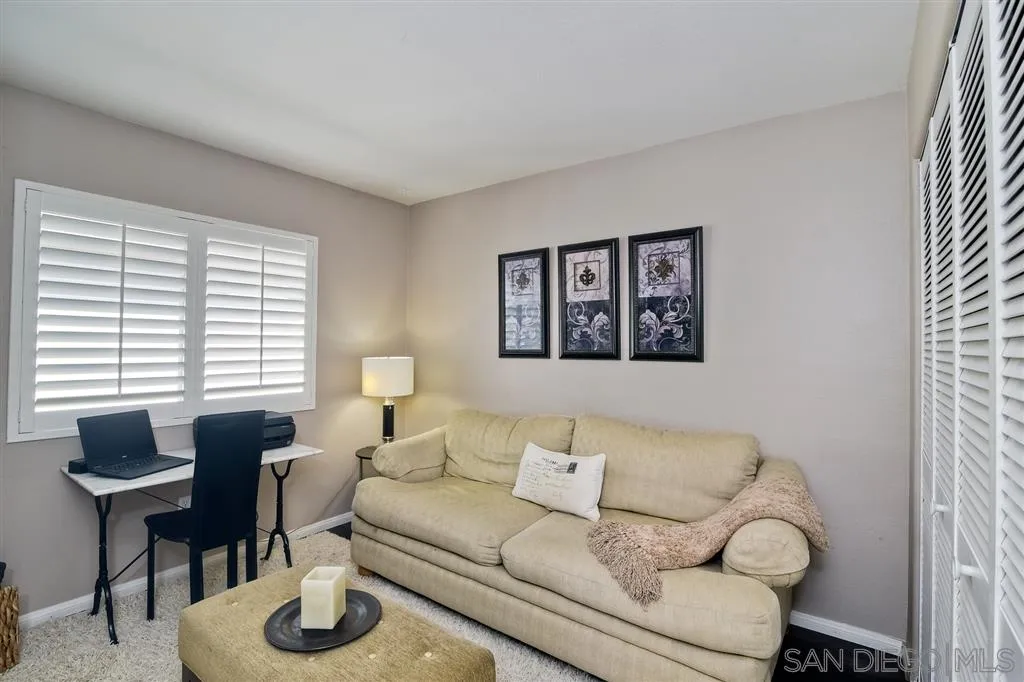11564 Village Ridge Road San Diego, CA 92131 - Photo 18 of 25 a living room with furniture and a large window