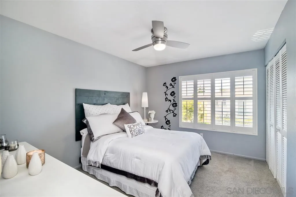11564 Village Ridge Road San Diego, CA 92131 - Photo 19 of 25 a bedroom with a bed and a window