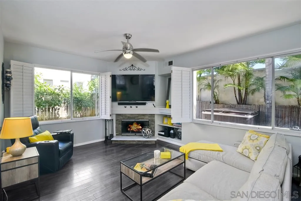 11564 Village Ridge Road San Diego, CA 92131 - Photo 7 of 25 a living room with furniture fireplace and a large window