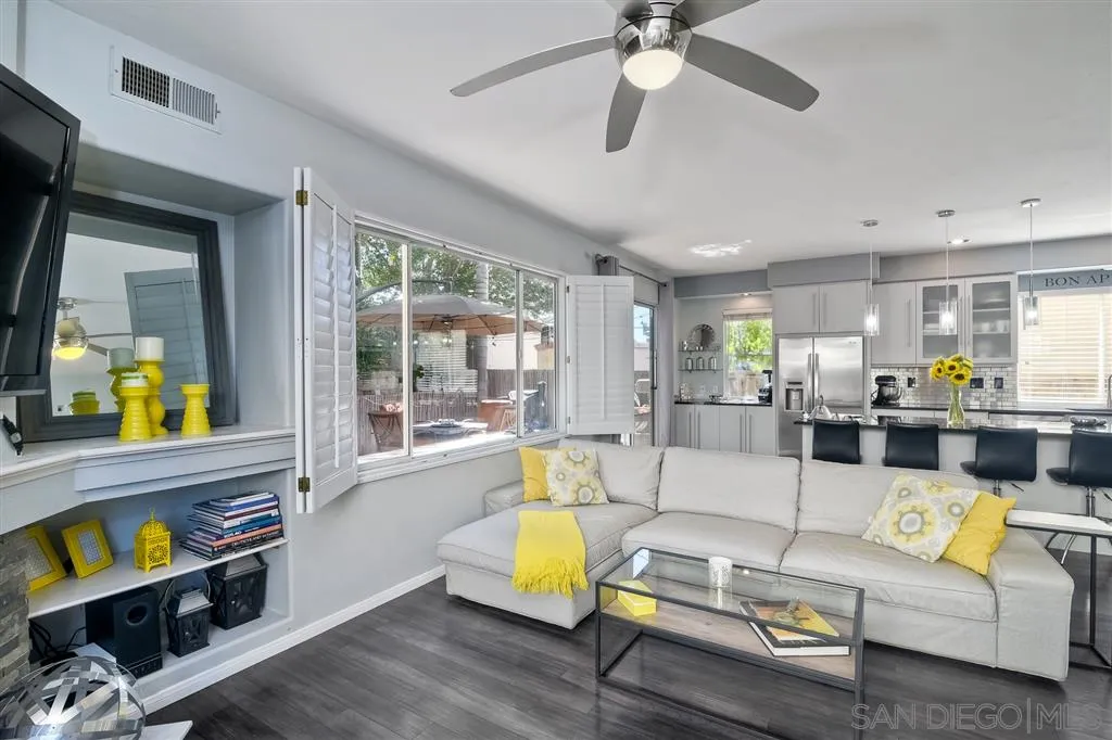 11564 Village Ridge Road San Diego, CA 92131 - Photo 9 of 25 a living room with furniture and a large window