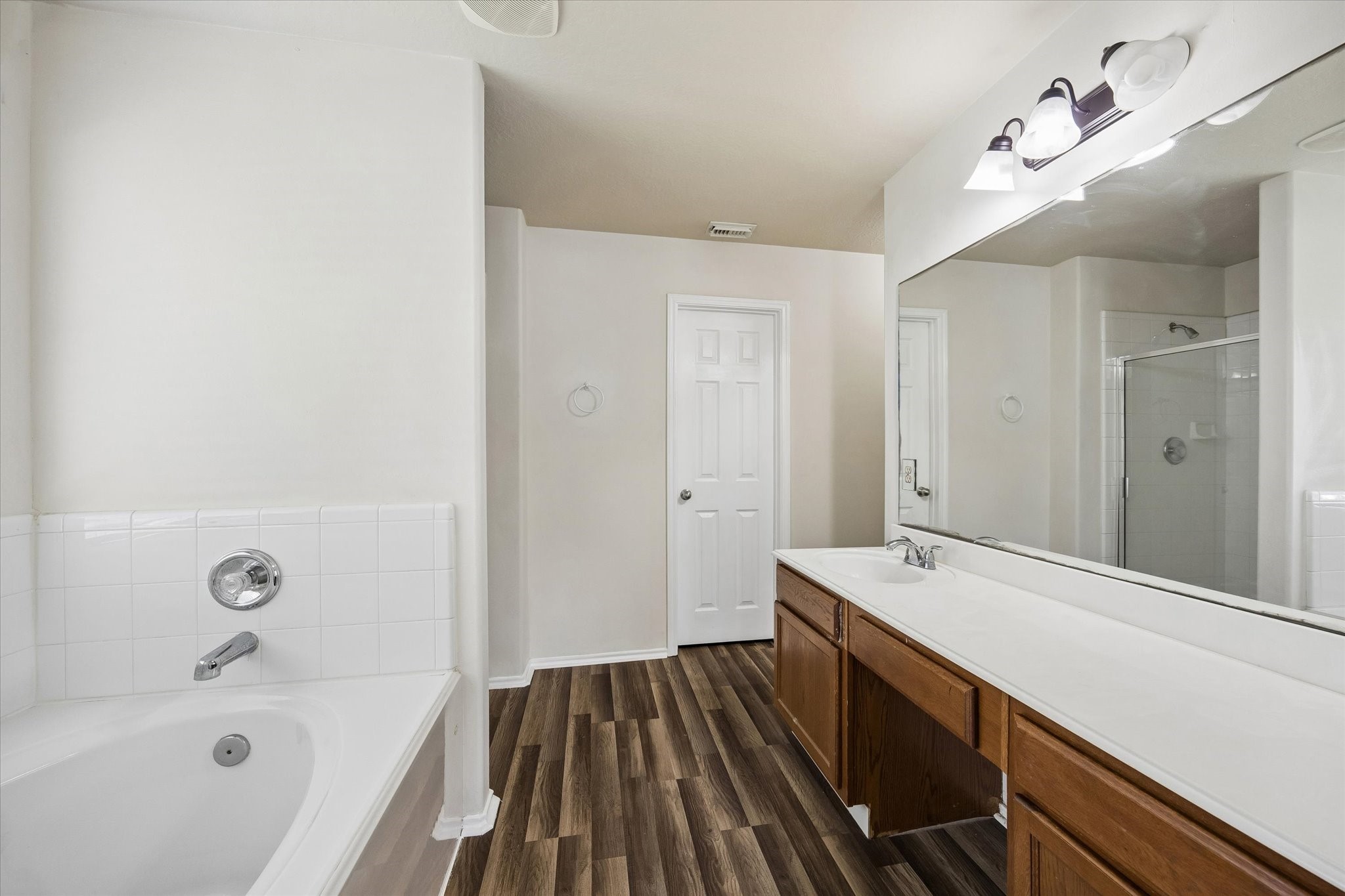 2614 Balsam Ridge Way Fresno, TX 77545 - Photo 9 of 14 a bathroom with a sink a bathtub and a shower