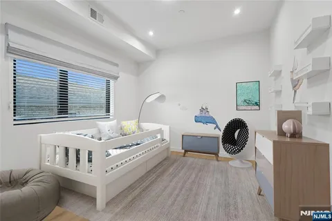 a bedroom with furniture and a window