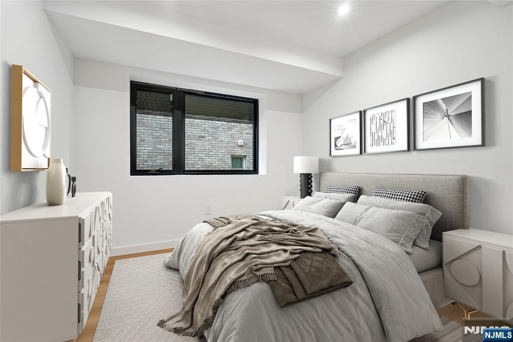 426 Aurora Avenue Cliffside Park, NJ 07010 - Photo 16 of 38 a bedroom with a bed and a window