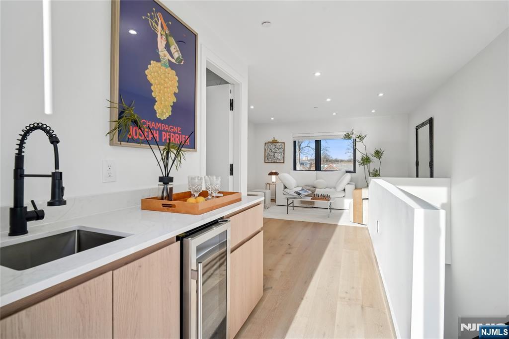 426 Aurora Avenue Cliffside Park, NJ 07010 - Photo 19 of 38 a kitchen with stainless steel appliances granite countertop a sink and dishwasher a stove with wooden floor