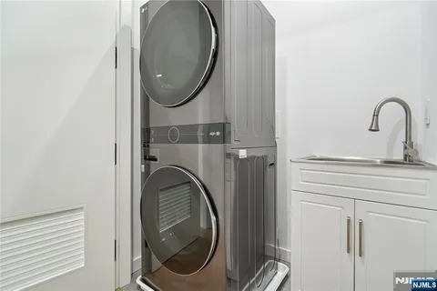 a close view of utility room with washer and dryer
