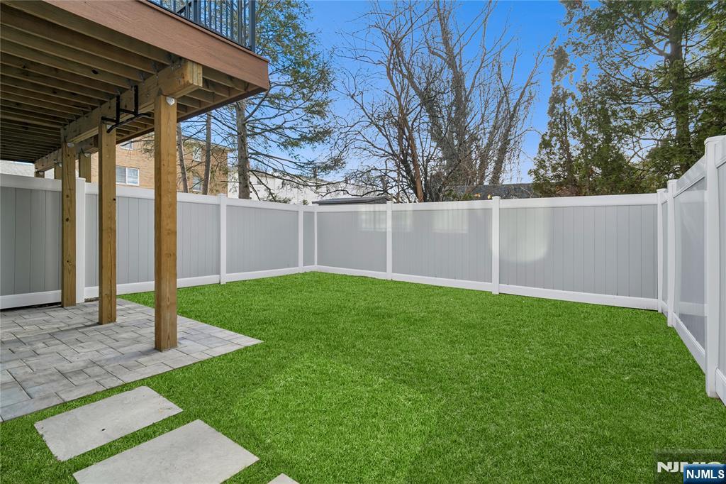 426 Aurora Avenue Cliffside Park, NJ 07010 - Photo 30 of 38 a backyard of a house with lots of green space