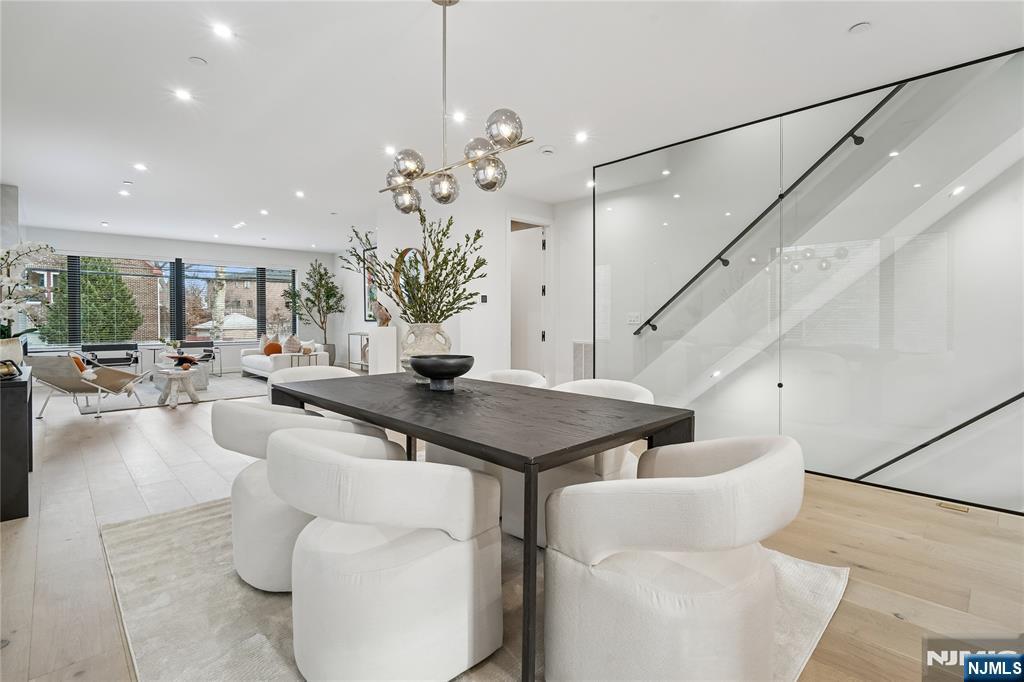 426 Aurora Avenue Cliffside Park, NJ 07010 - Photo 3 of 38 a living room with furniture and a chandelier