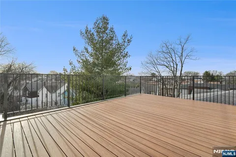 a balcony with wooden floor