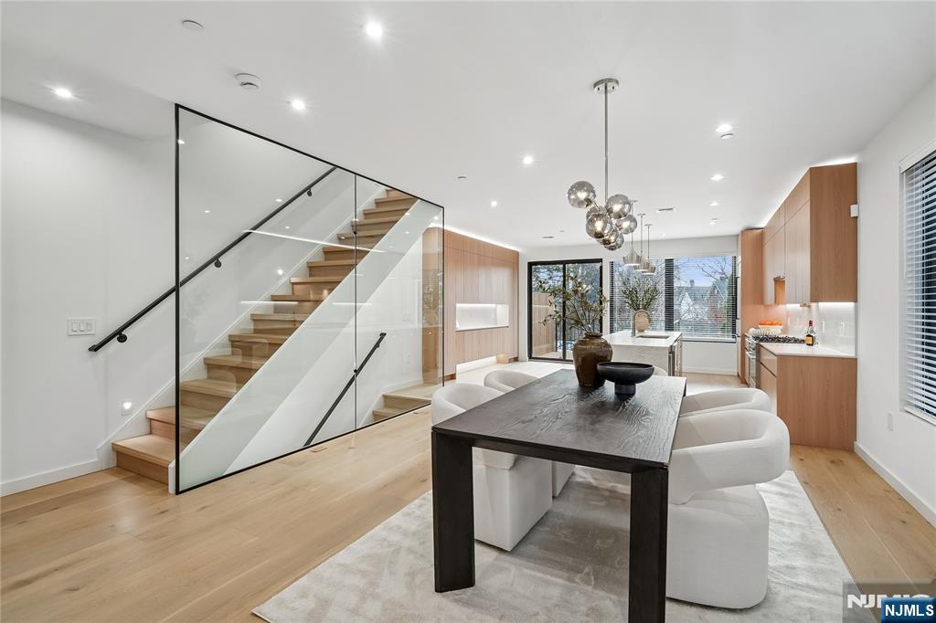 426 Aurora Avenue Cliffside Park, NJ 07010 - Photo 4 of 38 a dining room with furniture a chandelier and wooden floor