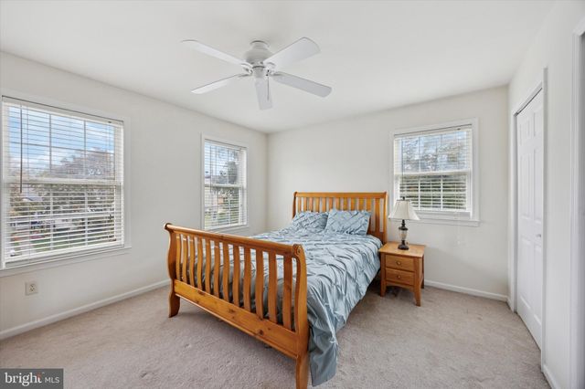 a bathroom with a sink toilet and a mirror