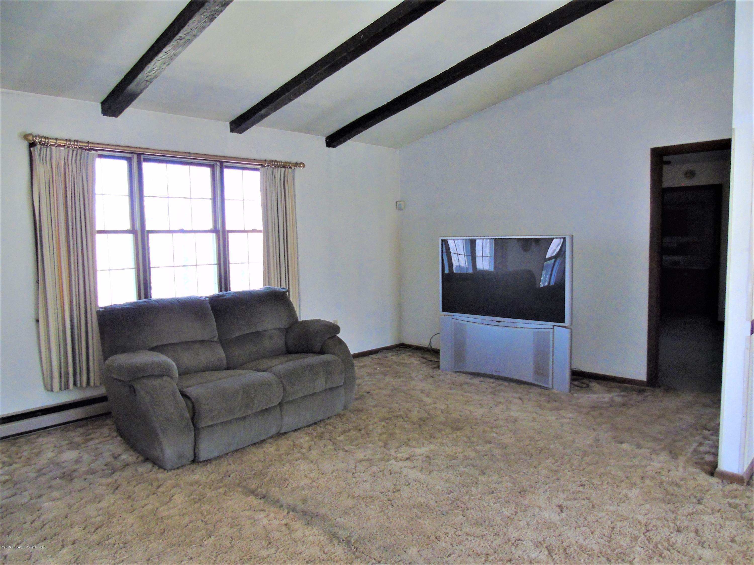 123 Anderson Road Lake Ariel, PA 18436 - Photo 11 of 37 a living room with furniture and a flat screen tv