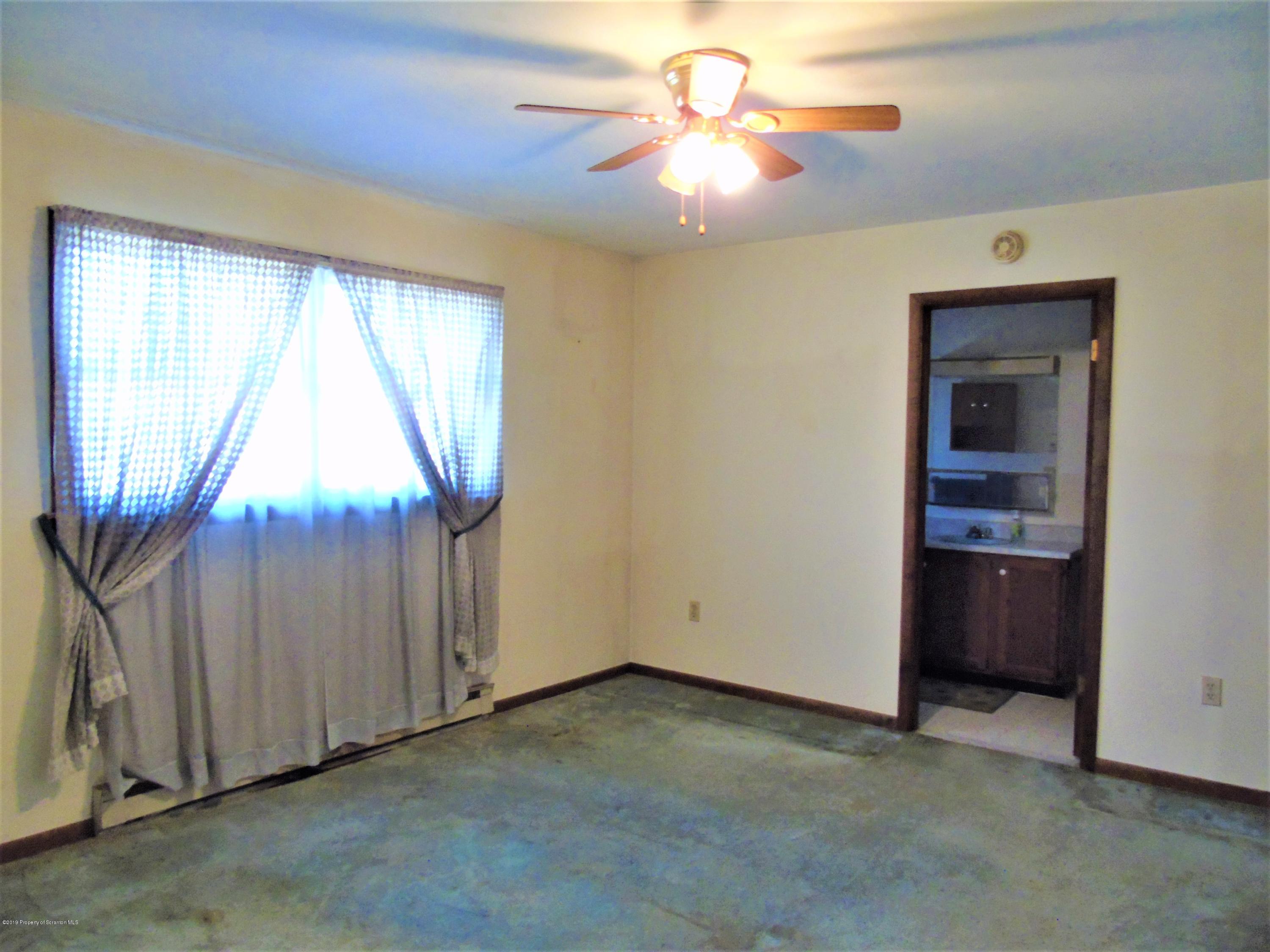 123 Anderson Road Lake Ariel, PA 18436 - Photo 18 of 37 an empty room with windows and fan