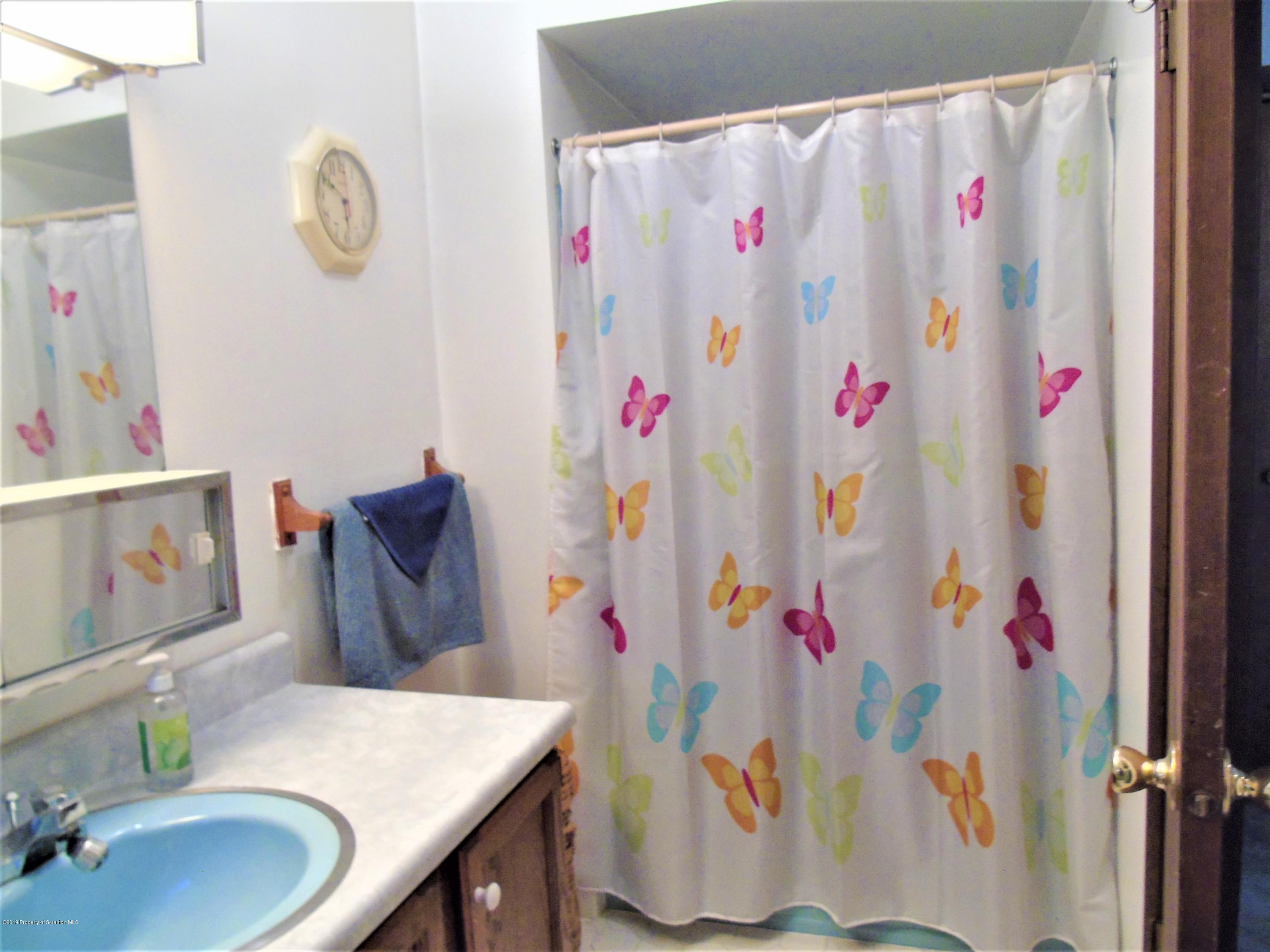 123 Anderson Road Lake Ariel, PA 18436 - Photo 20 of 37 a bathroom with a sink and a mirror