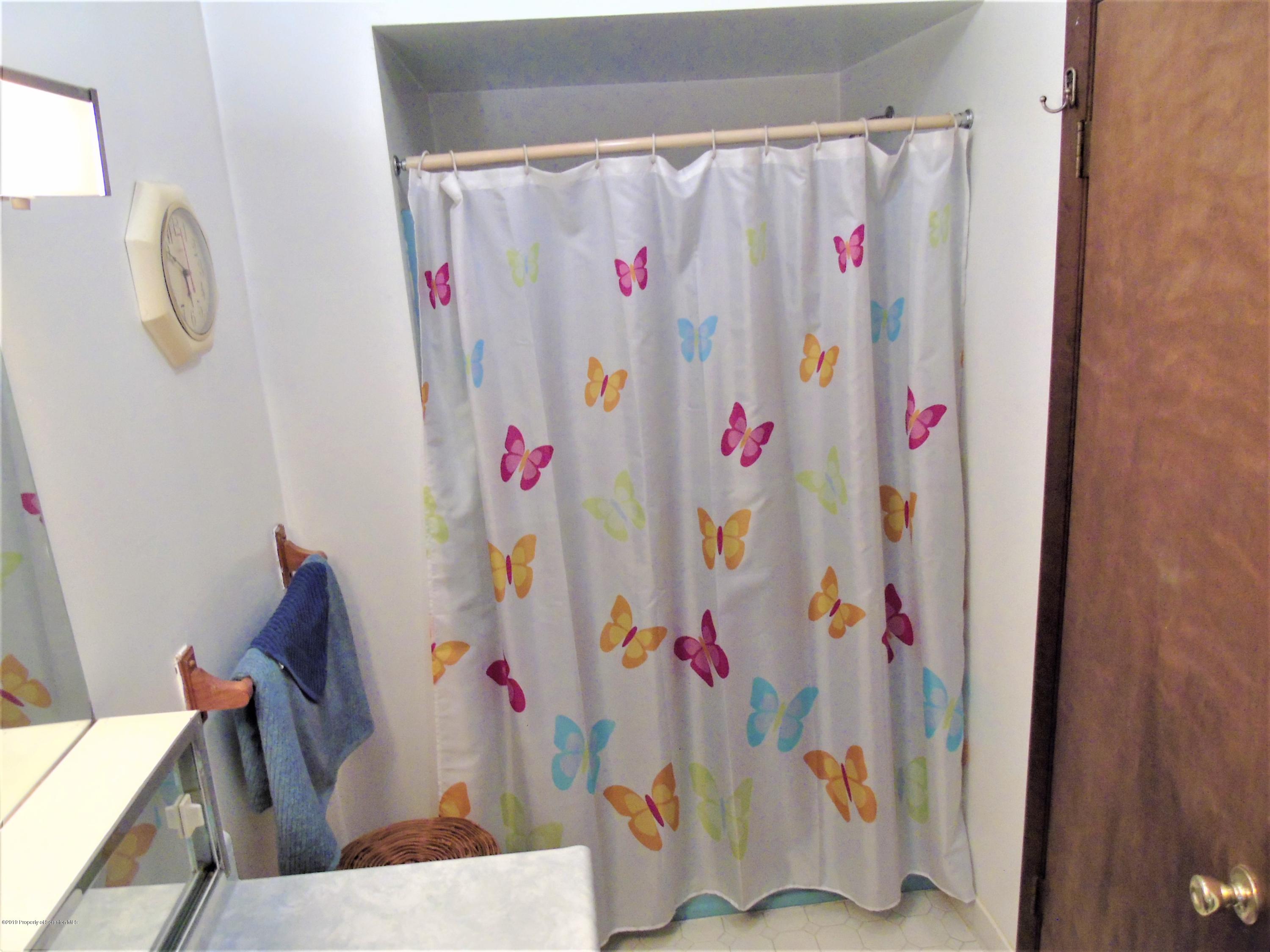 123 Anderson Road Lake Ariel, PA 18436 - Photo 21 of 37 a bathroom with a shower curtain and a curtain
