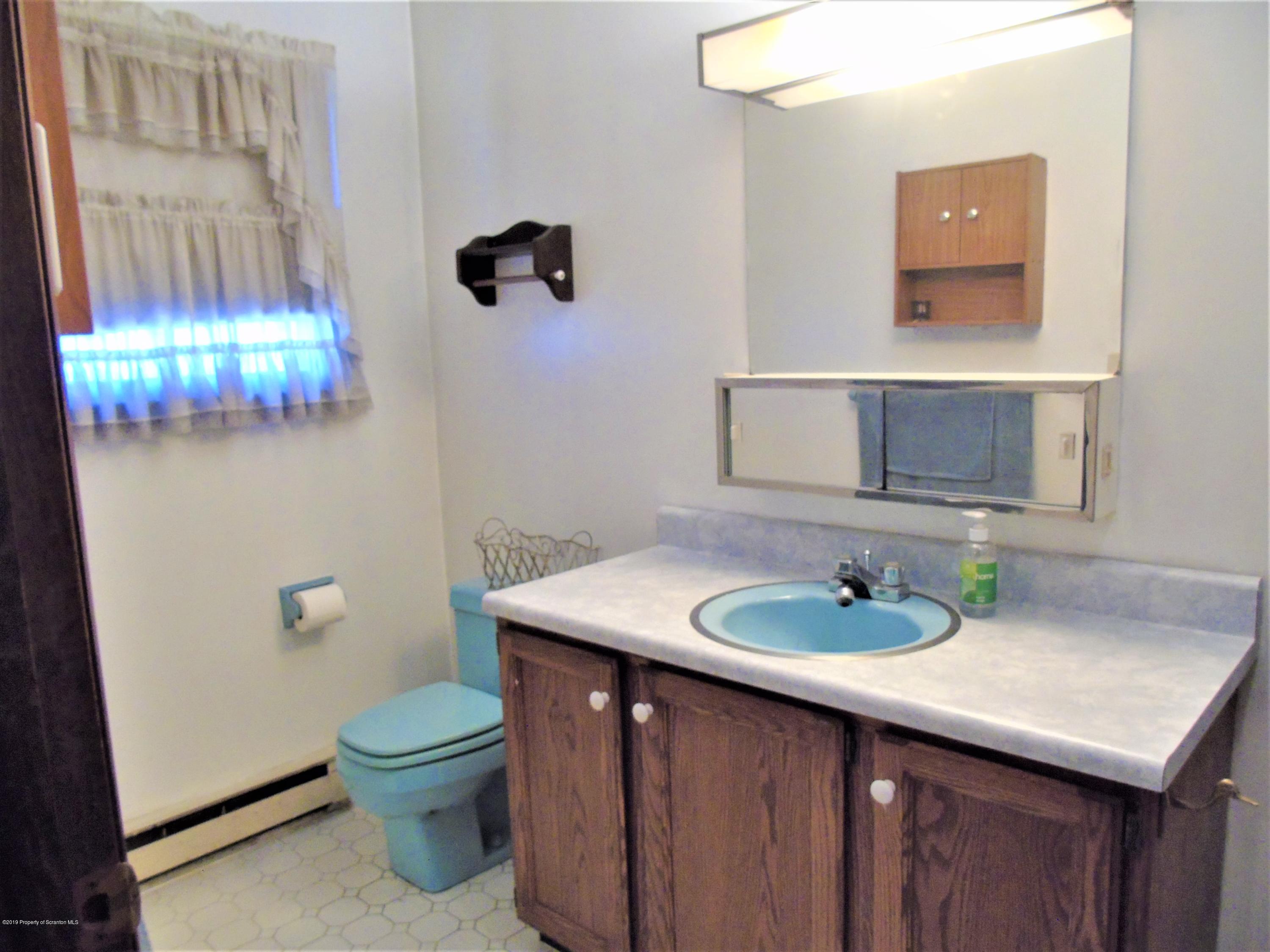 123 Anderson Road Lake Ariel, PA 18436 - Photo 22 of 37 a bathroom with a sink toilet and vanity