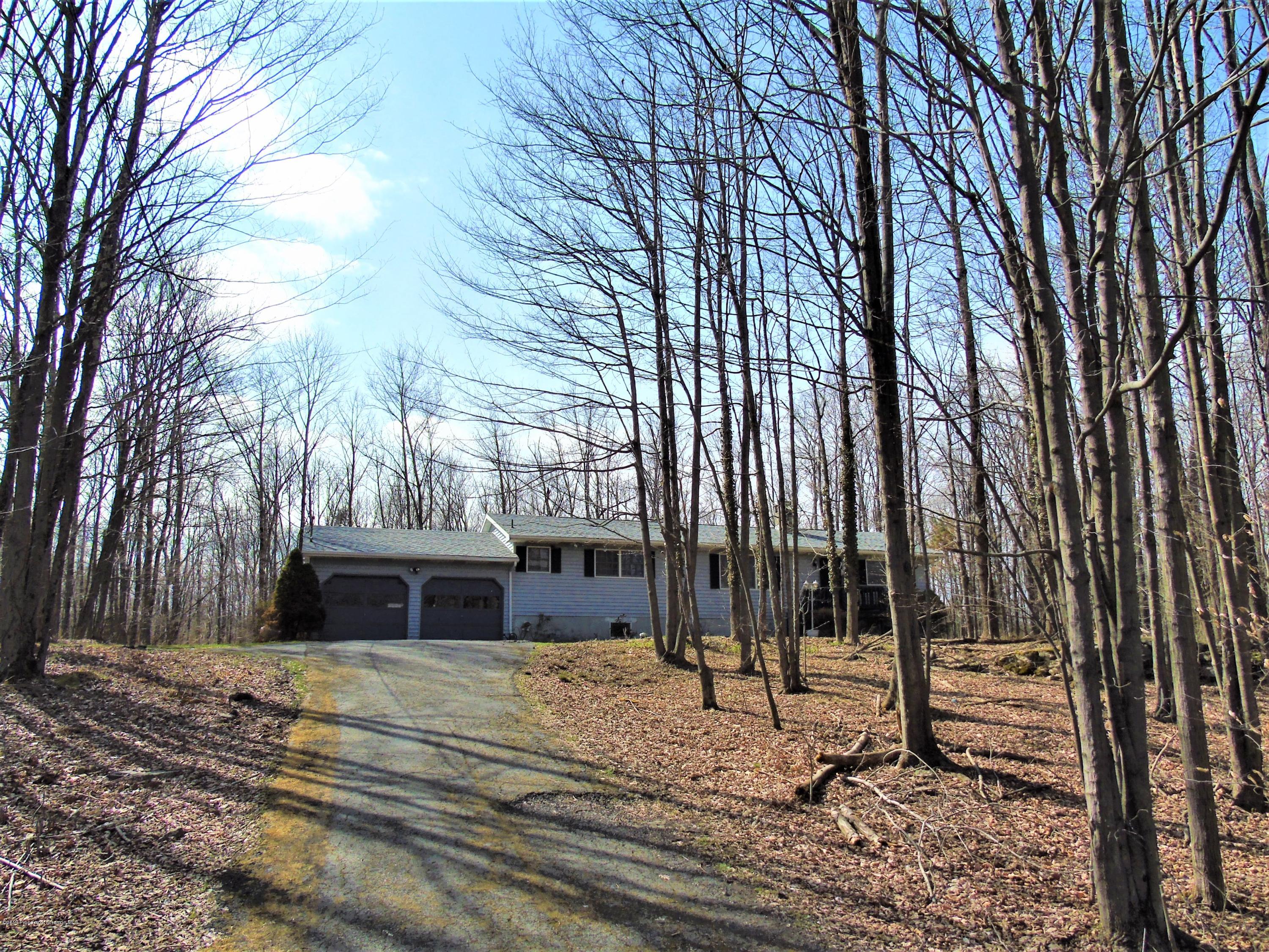 123 Anderson Road Lake Ariel, PA 18436 - Photo 24 of 37 a house with a trees in the background