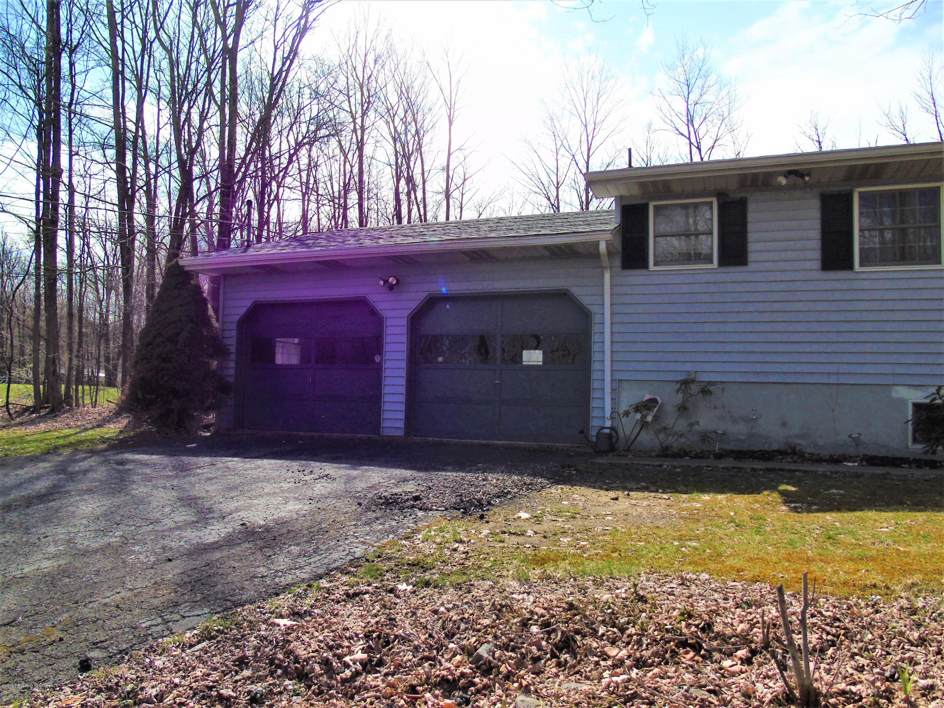 123 Anderson Road Lake Ariel, PA 18436 - Photo 26 of 37 a view of house with backyard and trees